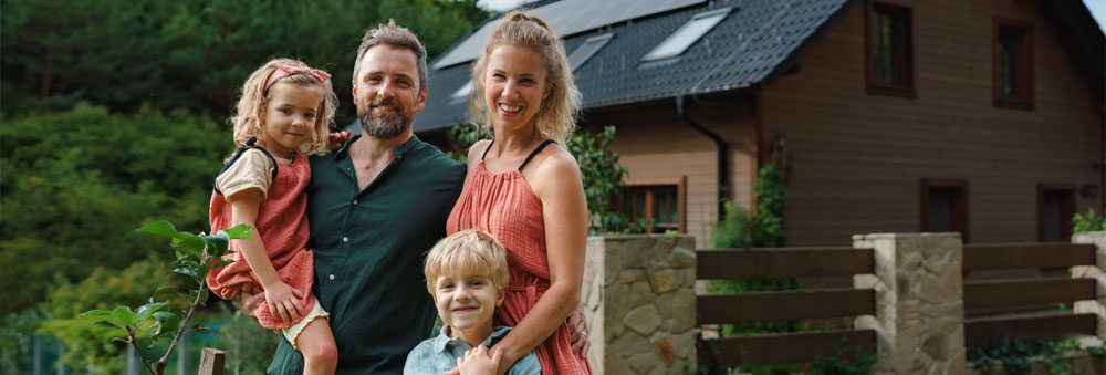 Independent Auto Insurance Agents Family In Front Of Home
